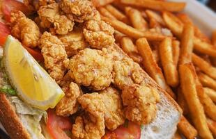 A fried oyster po'boy sandwich.