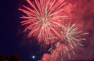 Red fireworks explode over the Cane River in Natchitoches, Louisiana
