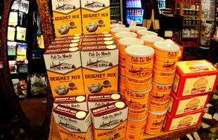 A colorful display of Cafe Du Monde beignet mix, coffee with chicory and creamy pralines.