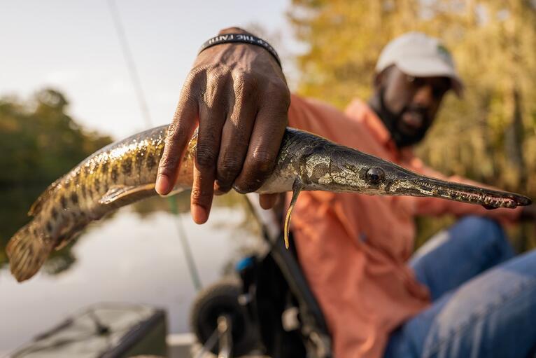 Man holding a fish in Houma.